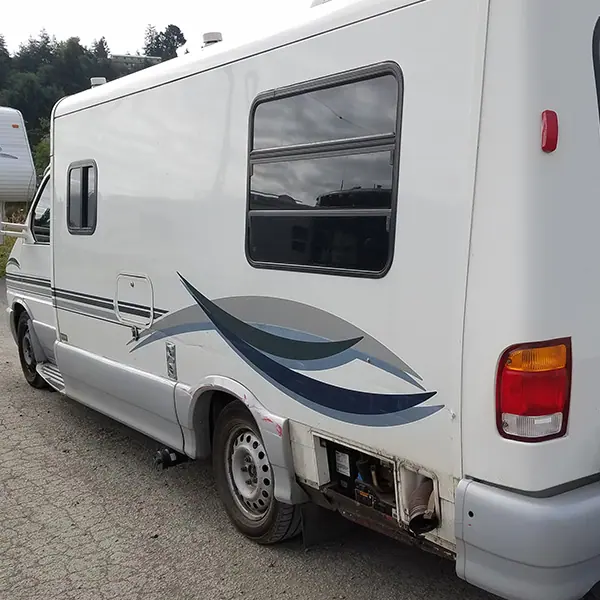 Class B camper van with body damage, before repair