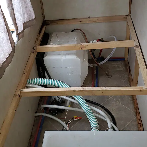 Fresh water tank installed in a framed RV compartment